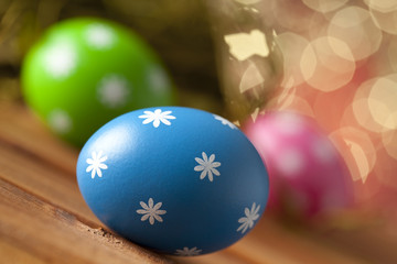 Colored Easter eggs on wooden planks