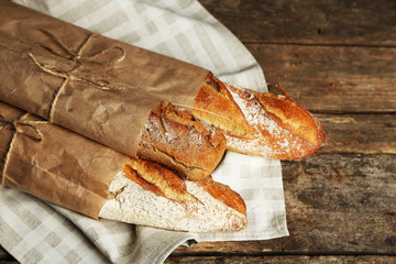 Fresh bread on old wooden table