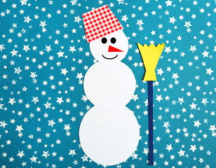 Handmade snowman on bright background