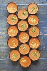 Tasty chocolate candies on wooden table