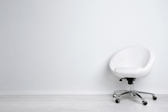 Modern Chair On White Wall Background