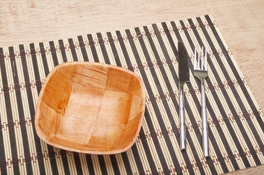 Bowl and cutlery on the table