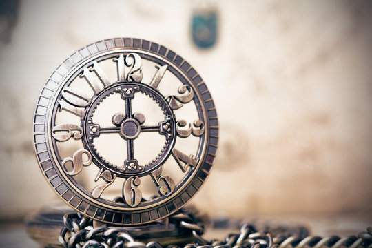 Old Pocket Watch Over Vintage Map