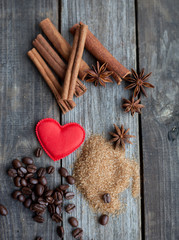 cinnamon sticks and anise stars on rustic wooden background