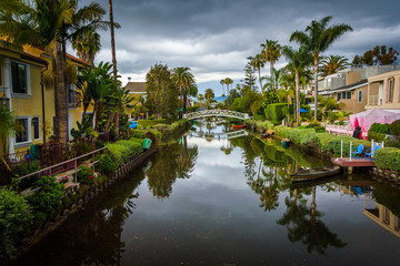 Fototapeta na wymiar Houses and bridge along a canal in Venice Beach, Los Angeles, Ca