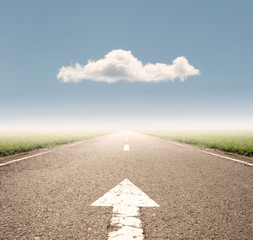arrow on asphalt road to the horizon