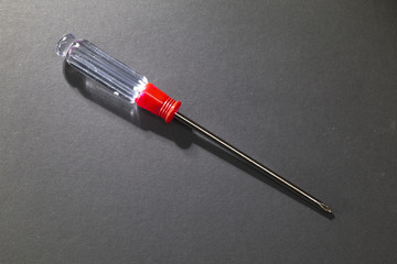 Metal Phillips screwdriver with a transparent plastic handle