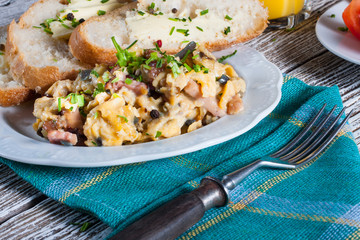 Scrambled eggs with ham and chives.
