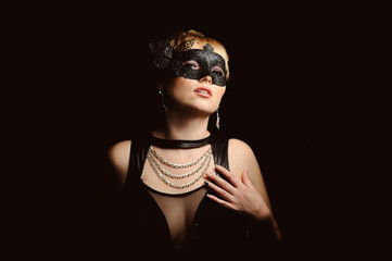 Close up portrait of woman in mysterious mask