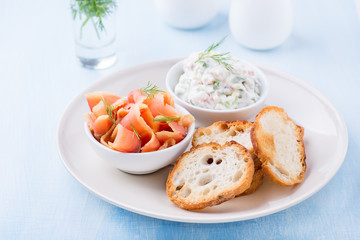 Smoked wild salmon, baguette and soft cheese spread with herbs