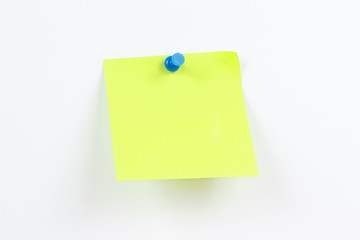 Green sticker on a white message board