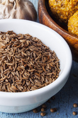 Cumin seeds in a white bowl