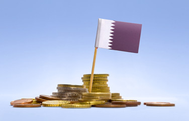 Flag of Qatar in a stack of coins.(series)