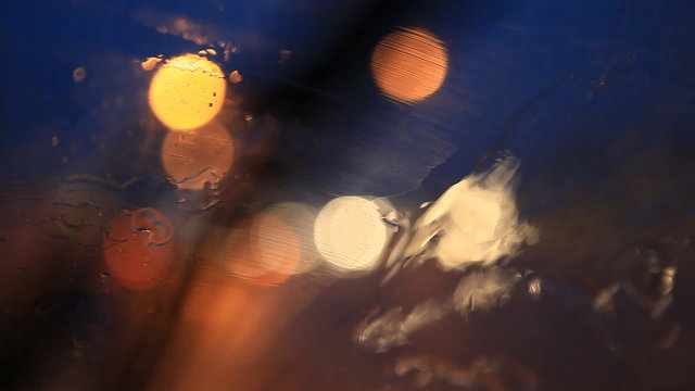 rain and wipers on the front windshield of car, sad, cry