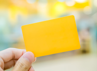 Hand holding card