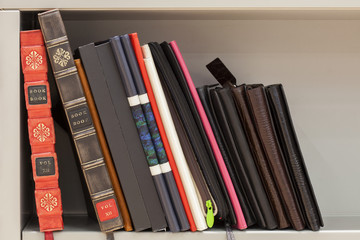 old and new books and albums on the same shelf