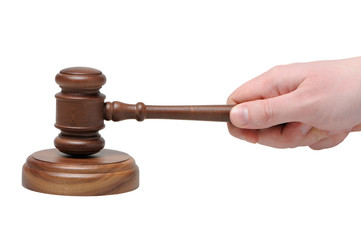 Hand with gavel on a white background