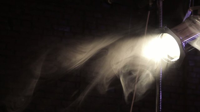 beautiful smoke in front of spot light, switch off