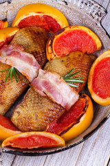 Roasted duck breast fillet with bacon and grapefruit