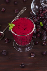 Frozen black currant berries smoothie with mint