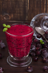 Frozen black currant berries smoothie with mint