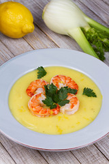 Fennel and potato cream soup with shrimps