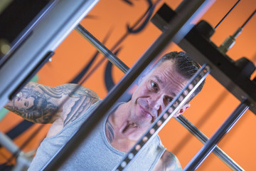 man making lateral pull downs - workout routine .