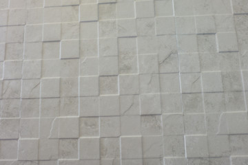 white tile bathroom wall