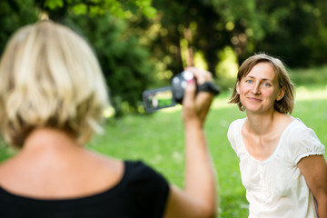 Senior mother is taking video of her child