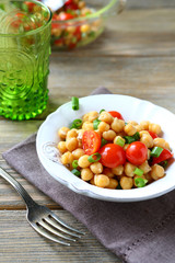 Salad with boiled chickpeas and tomatoes