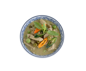 Thai green curry pork on dish with white background