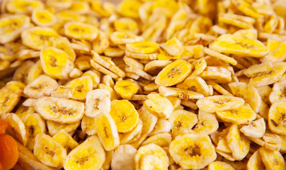 Slices of dried bananas close up, background