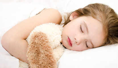 Adorable little girl sleeping with toy