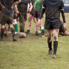 Fototapeta premium Rugby, muddy game of rugby, square cropped image