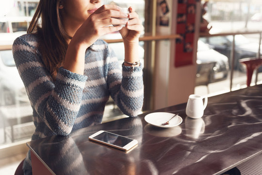 Pensive Woman At The Bar