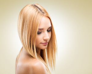 Fototapeta premium Beautiful blonde woman in profile, looking down 
