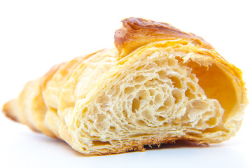 Freshly baked croissant. All on white background.