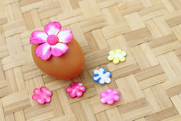 egg decoration with pink paper flower