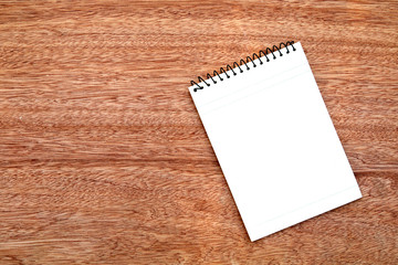 notepad on wooden background