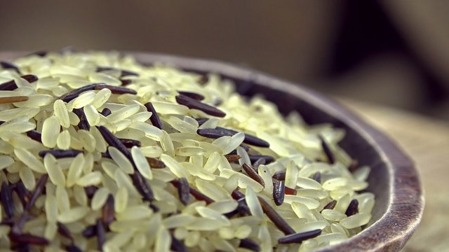 Heap of mixed rotating Rice (seamless loopable 4K footage)