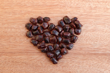 pile of tamarind seed in shape heart