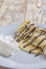 crepe with banana and chocolate sauce