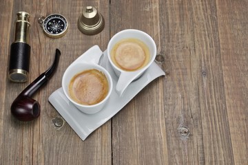 Spyglass, Compass, Smoking Pipe and Two White Espresso Coffee Cu