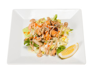 salad with lettuce, seafood, walnut sause