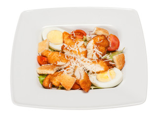 salad cesar with lettuce, chicken, egg, cheese, crackers, cherry