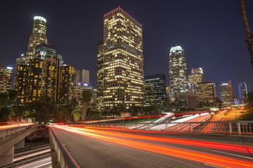 Fototapeta na wymiar Los Angeles downtown buildings and highway traffic at night