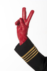 Four gold rings on airline officers uniform Two finger gesture