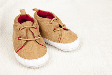 pair of baby shoes on fur