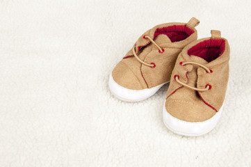 pair of baby shoes on fur