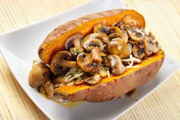 Oven cooked sweet potato , filled with mushroom